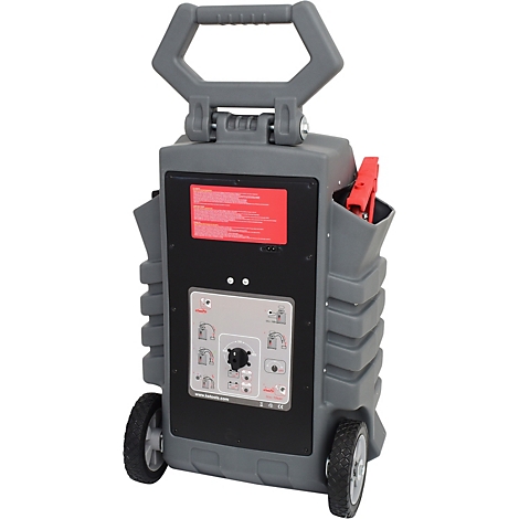 Grauer Batterielader mit Griff, Rädern und Anzeigen. Rote Klemmen und eine Anzeige sind deutlich sichtbar.